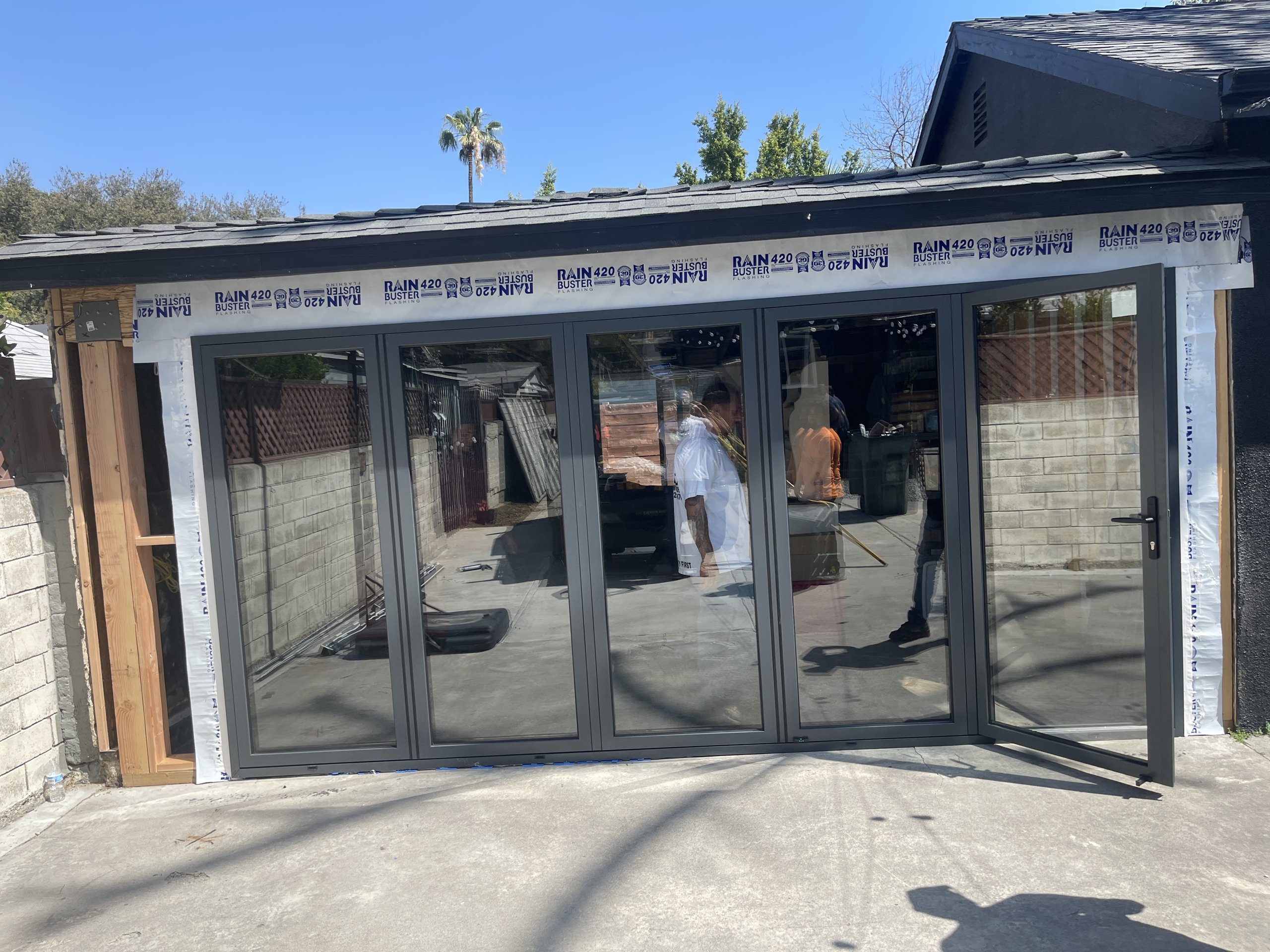 Multi-panel folding glass door installation in Pasadena